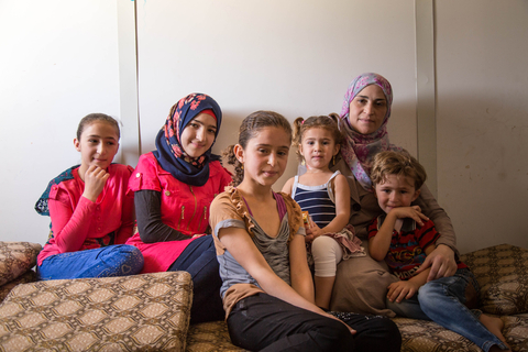 Saba with her mother and siblings.  “The family has a big role in the decision." © UNFPA Jordan/Sima Diab